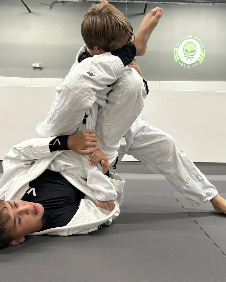 Big Kids drilling armbars in class