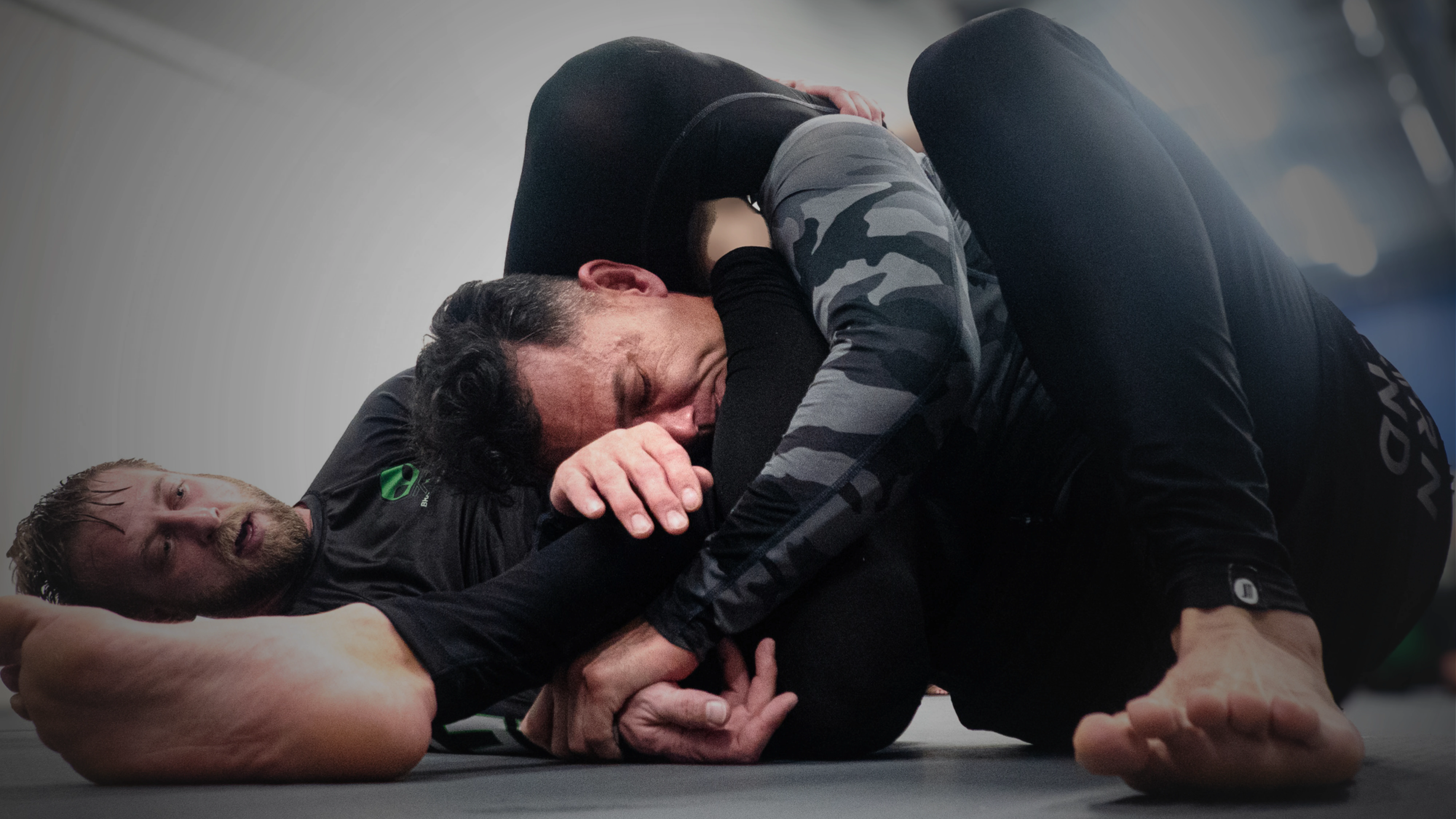 Adults rolling at Believe Jiu Jitsu