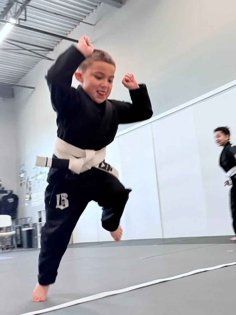 Big Kids student leaping during Believe Jiu Jitsu kids class